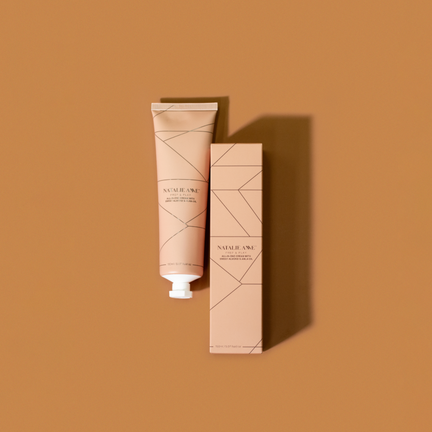 Natalie Anne Prep & Play All-In-One Cream on warm brown background