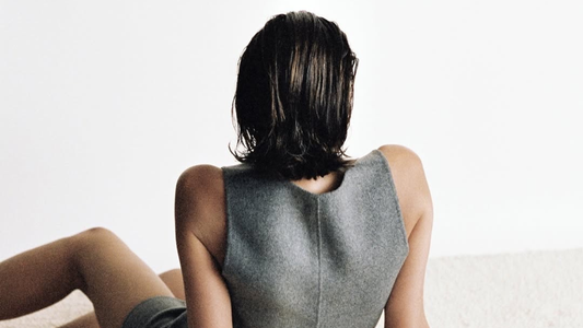 Woman with her back turned with slicked back bob haircut
