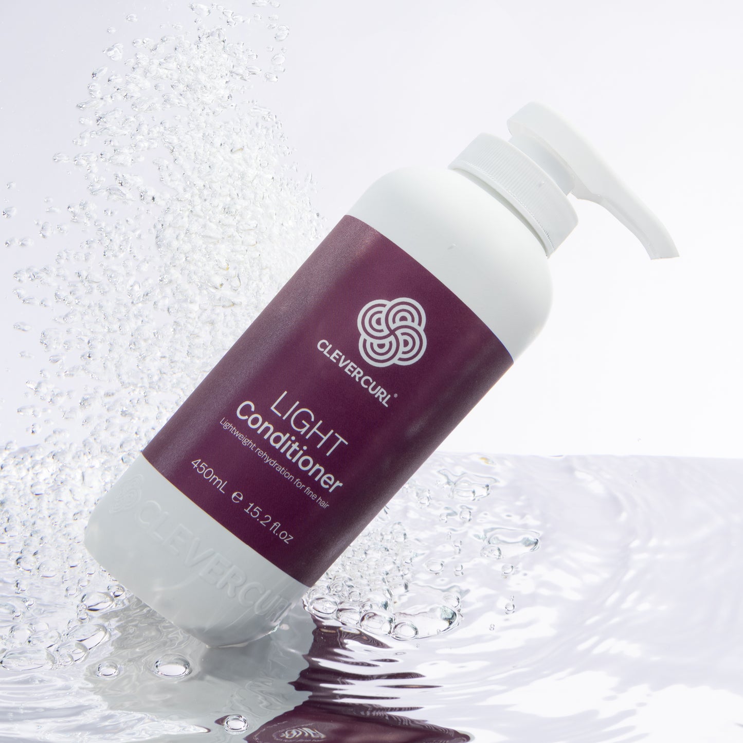 Clevercurl Light Conditioner 45oml bottle with water droplets on a light background