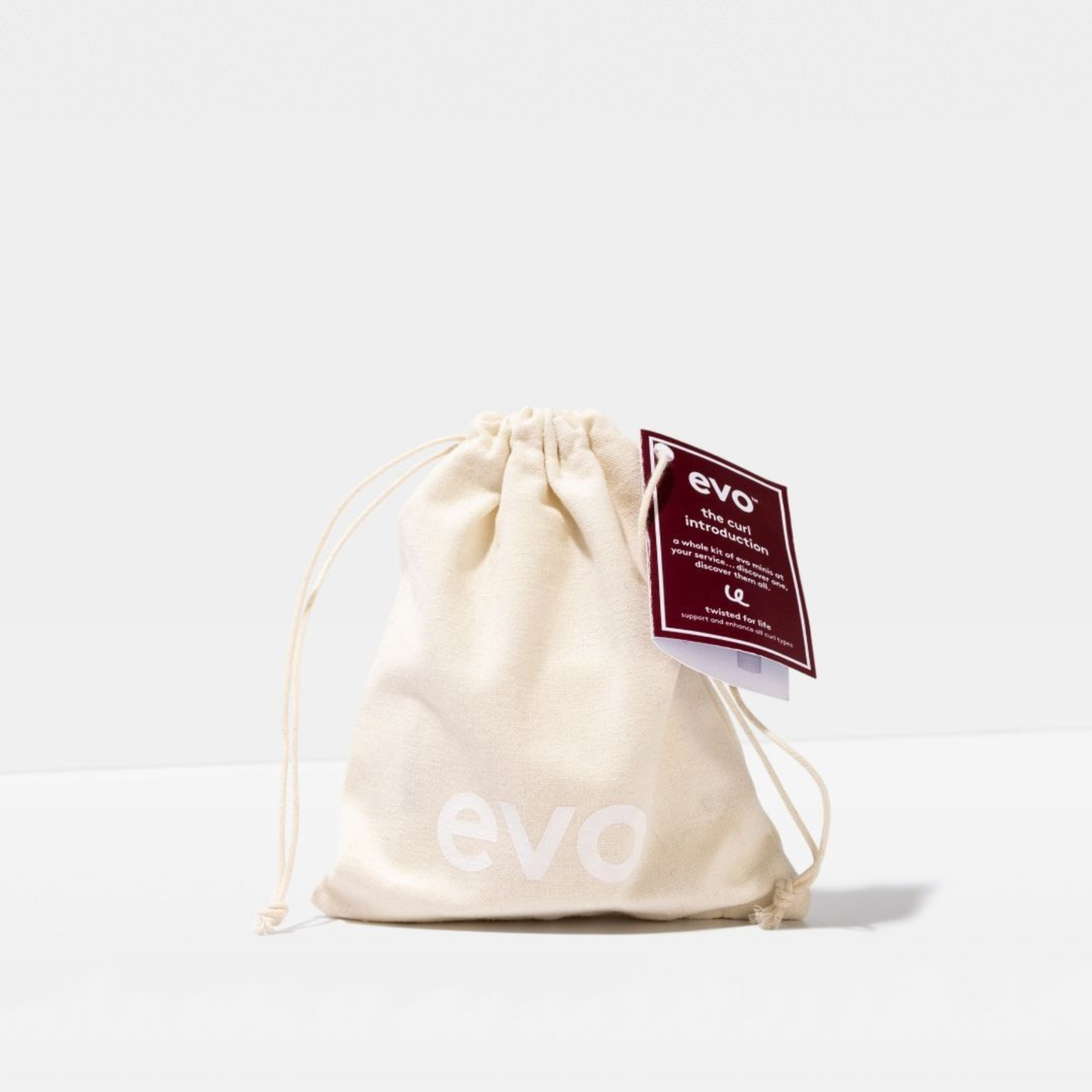 Beige drawstring bag with 'evo' branding on a white background