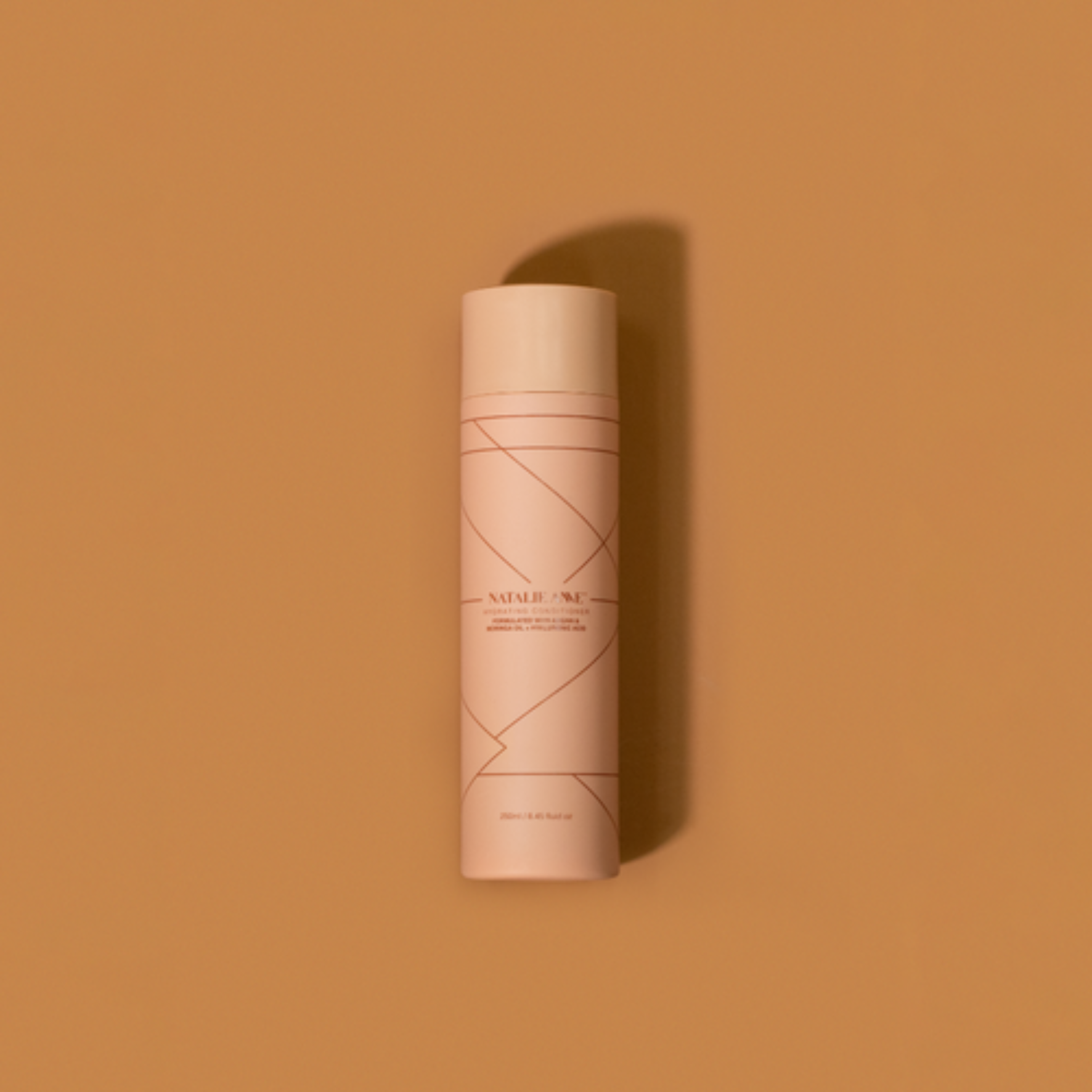 Natalie Anne Hydrating Conditioner on warm brown background